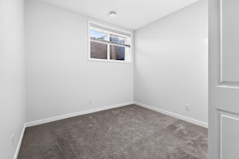 Suite bedroom two, 215 Mallard Grove SE